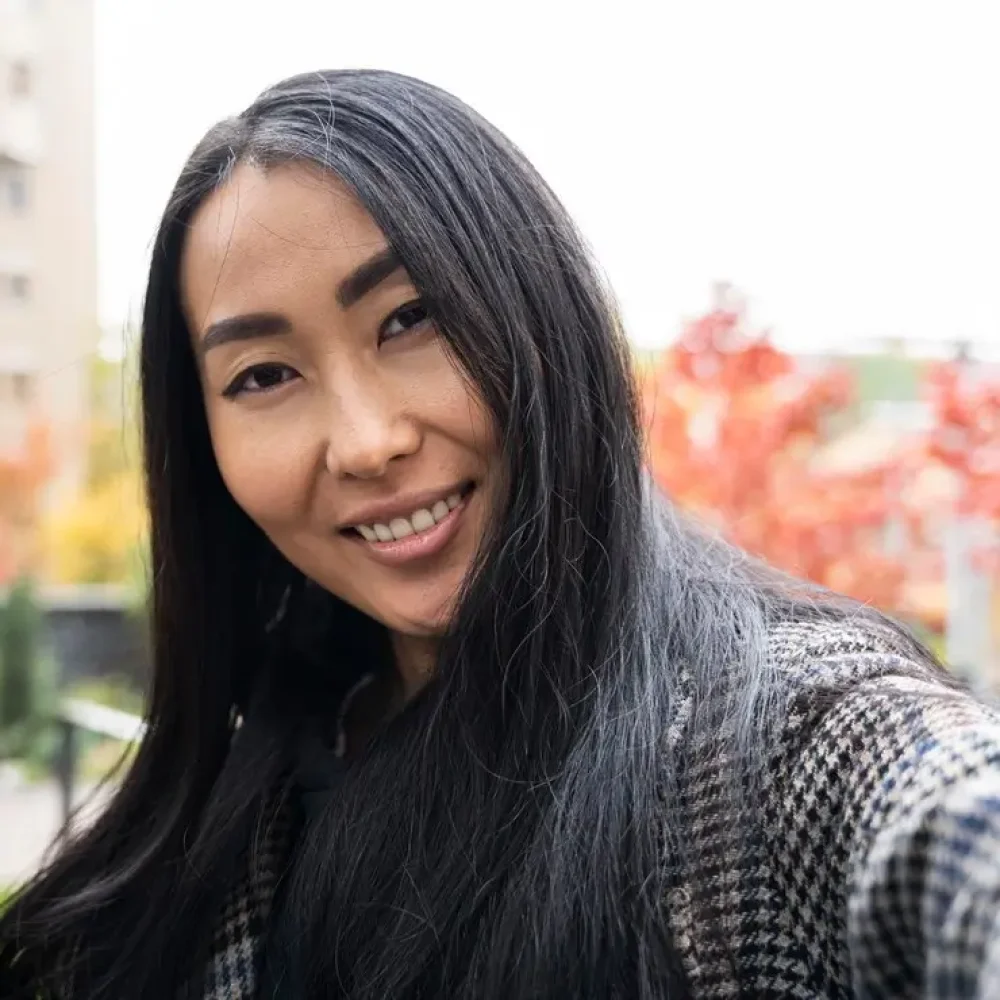 close-up-smiley-woman-taking-selfie_23-2148750356