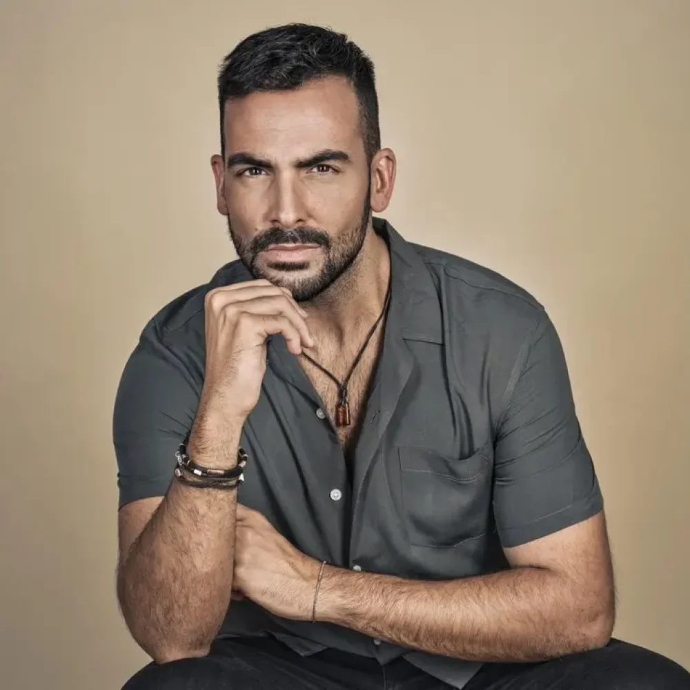 portrait-attractive-bearded-young-man-from-spain-elegant-gray-shirt_181624-58370
